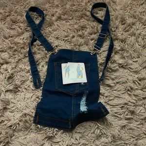 Overalls it can hook on to shorts and if u don’t want to wear u can detach it